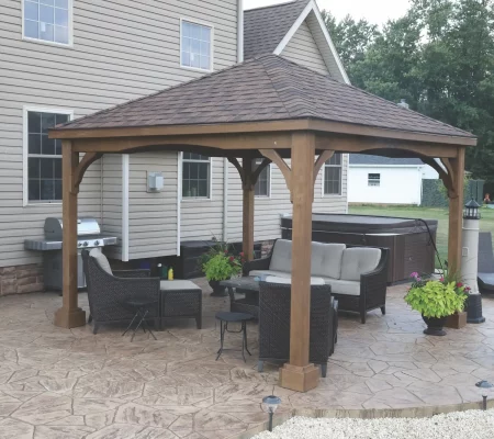 A Mocha Hampton Wood Pavilion beside a pool.