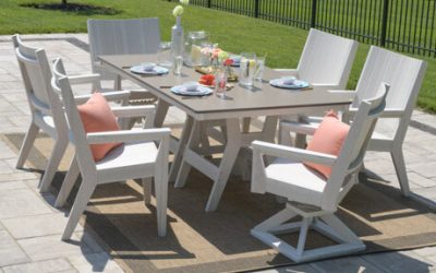 HARBOR 44” X 72” RECTANGULAR DINING TABLE IN SEASHELL WITH BRONZE HAMMERED TOP. MAYHEW CHAT DINING AND CHAT SWIVEL ROCKER DINING CHAIRS IN SEASHELL. PILLOW IN CAST CORAL.
